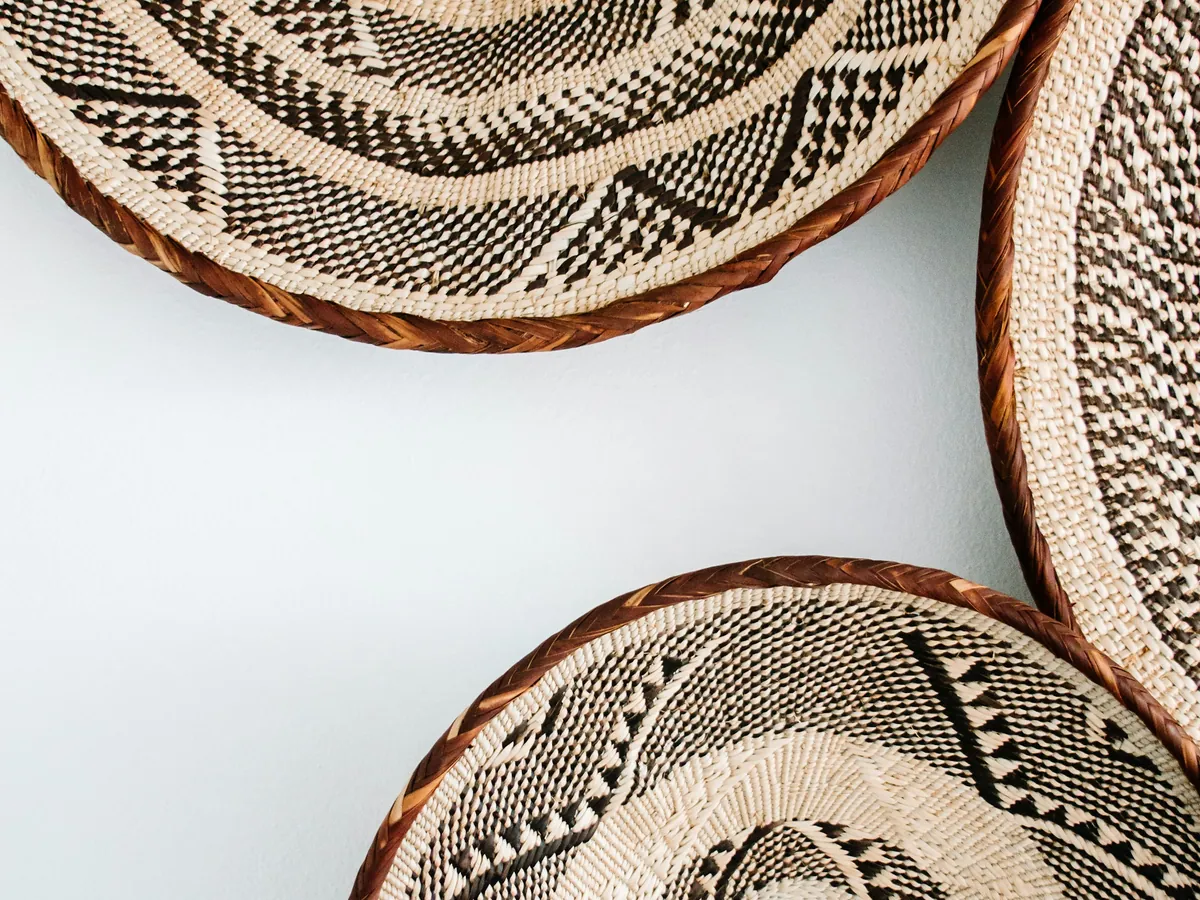 Woven baskets on a white wall
